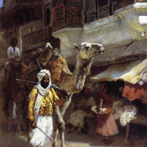 Man Leading A Camel