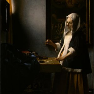 A woman holding a balance