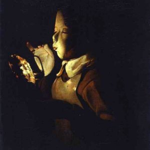 Boy Blowing at Lamp
